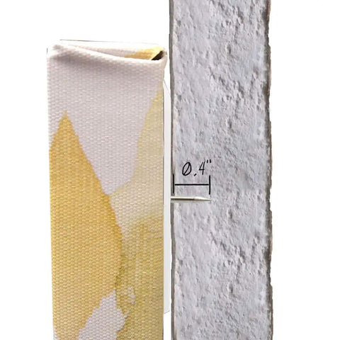 Place And Push Canvas Hangers for Drywall, 20 Pound Capacity, flush mount showing 0.4 inch gap between canvas and wall