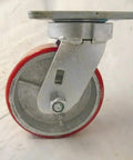 Built Tough Heavy Duty Swivel Casters With Bulletproof 5 Inch Polyurethane Wheels On Steel Core, showing red wheel and bracket.