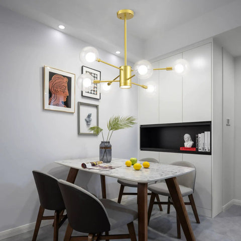 Dining room with Sputnik Chandelier In Gold Finish, 6 Light Built-In Dimmable LED Spotlight over a table with modern decor.