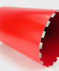 Red 11-inch diamond core drill bit with segmented edge for concrete and masonry
