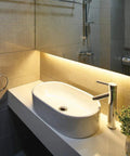 Modern bathroom with sink illuminated by Universal Dimmable 24 Watt 12V DC LED Driver With Triac Dimming For LED Strips