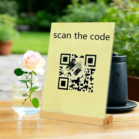Acrylic sign holder with wood base displaying QR code on a table with rose, 8.5 X 11 Acrylic Sign Holder With Wood Base, 3 pack.