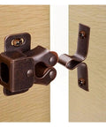 Upgrade Your Kitchen And Closets With These 12Pcs Bronze Cabinet Latch Springs That Lock Doors Fast Without Making A Sound While Keeping Things Neat And Organized For Sure. Close-up of bronze cabinet latch spring on wooden doors.