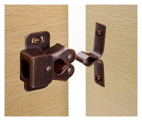 Upgrade Your Kitchen And Closets With These 12Pcs Bronze Cabinet Latch Springs That Lock Doors Fast Without Making A Sound While Keeping Things Neat And Organized For Sure. Close-up of bronze cabinet latch spring on wooden doors.