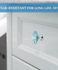 Heavy Duty Stainless Steel Round Cabinet Knobs And Slick Snowflake Drawer Pulls Built Tight For Daily Grind Kitchen And Closet Tasks Durable One Point One Inch hardware on a white cabinet.