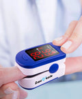 Fingertip Pulse Oximeter With Batteries Included For Quick SpO2 And Pulse Rate Readouts, Large LED Display, Navy Blue, Built For Athletes, Travelers, Climbers, Runners And Everyday Health Enthusiasts on finger