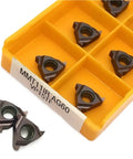 Ten Pack Of Premium Carbide Turning Inserts For CNC Metal Lathe Tool in an orange case showing details and cutting edges.