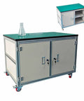 Rock Solid Rolling Workbench With Antistatic Surface And Heavy Duty Steel Frame Built Damn Tough Three Tier Storage Cart showing green top and cabinets.