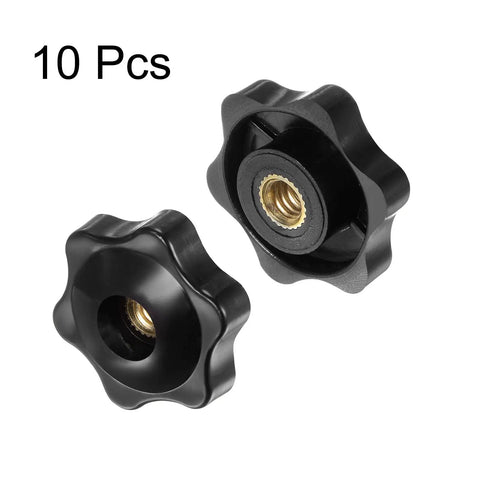 Pair of black Ten Pack Star Knobs That Grip Like A Boss Quarter Inch Twenty Female Thread, 32mm Head, with brass insert