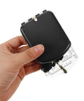 Person holding black orienteering compass with luminous mirror and ruler for hiking camping survival and backpacking