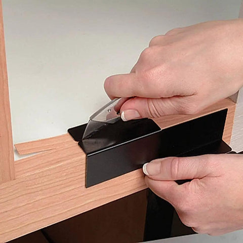 Person using Edge Trimmer Guide Pro Grade Edge Banding Cutter for cabinet refacing with precise alignment and flush cut capability.