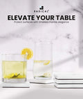 Solid White Square Marble Coasters Set Of Six, Polished Drink Pads For Dining Tables And Coffee Bars with drinks on display.