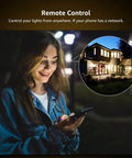 Woman using phone to control Smart LED E12 Candelabra Bulbs With Tunable White 2700K To 6500K, Dimmable Via App remotely.