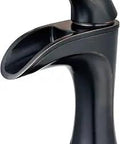 Side view of Single Handle Bathroom Sink Faucet In Tuscan Bronze Finish, 1-Hole Mount, with sleek trough spout.