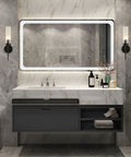 Mid Century Modern Black Wall Sconce Set Of Two 1 Light Clear Cylinder Glass Minimalist Vanity Lighting in a bathroom.