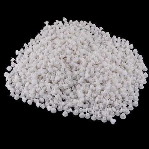 Pile of Must Have 1000 Pieces White Hinge Hole Plugs For Furniture And Home Improvement on black background