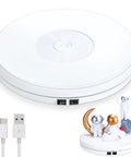 Tuanse 10 Inch Electric Motorized Rotating Turntable Cup Display Stand With Led Light, showcasing small astronaut figurines.