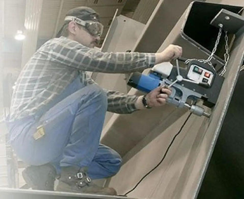High Performance Portable Magnetic Drill With Bulletproof Swivel Base And Killer Quick Change Keyless Cutter Setup Featuring Auto Feed Oil Tank For Zero Hassle Heavy Duty Steel Boring Job being used on thick metal.