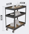 Three Tier Industrial Rolling Bar Cart With Thick Oak Shelves And Silent Casters For Living Room Hosting Hella Smooth Mobile Serving Trolley Top Shelf Storage Rack with glasses and dishes.