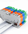 Ten Pack DIN Rail Terminal Block 4 Wire 2.5mm2 Spring Clamp Connector 300V ST 2.5 Quattro Green Heavy Duty installed on rail