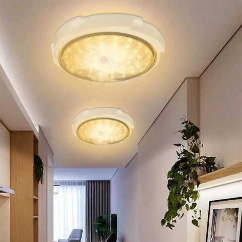 Solar Shed Light With Dimmable Remote Control 1000 Lumen LED, ceiling mounted, emitting warm white light in a modern room.
