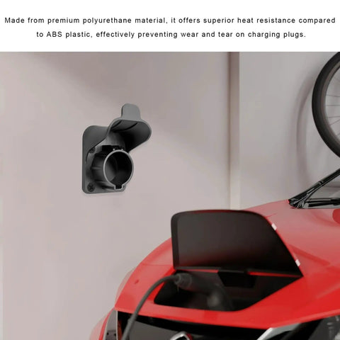 Gotta Get Your Cord Secure With This Electric Vehicle Charger Holder For SAE J1772 Stations mounted on a wall with a red car.