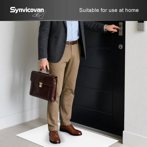 Heavy Duty Sticky Floor Mats For Entryway Dust And Dirt Trap Runner Rolls 26 By 45 Inch 5 Pack in use at home by an office worker.