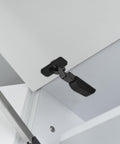 Slick Soft Close Concealed Cabinet Door Hinge With Silent Damping for Kitchen Cabinets mounted on white cabinet door, side view.