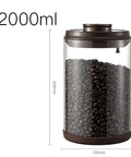 Round High Borosilicate Glass Coffee Bean Container With Real Deal Airtight Seal filled with coffee beans, 2000ml capacity.