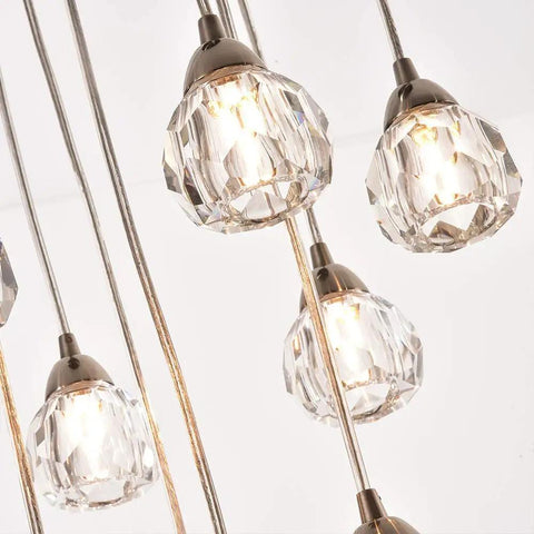Close-up of raindrop globe design on 10 Light Stair Crystal Chandelier With Raindrop Globe Glass Ceiling Lighting In Nickel Finish