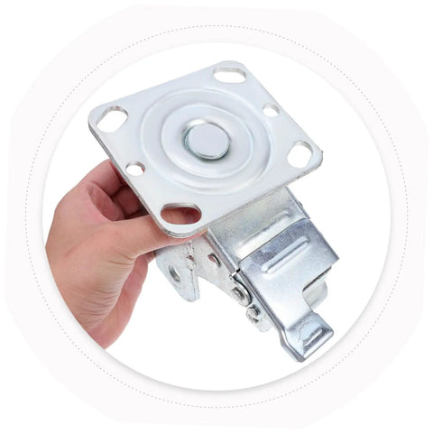 Rugged Steel Swivel Caster Bracket With Locking Brake And Four Inch Wheels For Heavy Machinery showing a close-up hand-held view.