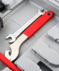 All-In-One Bicycle Repair Tool Kit With 48 Essential Tools In Durable Case, featuring wrenches and red handle details.
