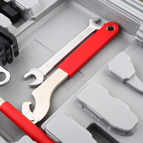 All-In-One Bicycle Repair Tool Kit With 48 Essential Tools In Durable Case, featuring wrenches and red handle details.