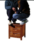 Two individuals squatting on a Totally Solid Rustic Brown Nightstand Fits Every Room Layout Stackable Side Table With Front Storage Drawer Durable Wood Finish.