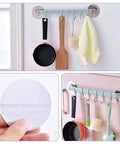 No Drill Hassle Self Adhesive Towel Rack Wall Mount Hook With Hella Strong Grip For Bathroom Kitchen And Living Room Totally Rad Space Saving Storage Solution Smooth Finish with kitchen tools and towels.