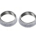 Pair of 2.5-inch exhaust donut gaskets with graphite-textured exterior and metal inner surface.