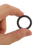 Heavy Duty Rubber Retaining Rings And Fastener Pins For Electric Wrench Socket Replacement 50 Set With Multi Insert Adapters For Screws And Sockets Easy Storage, hand holding a black rubber retaining ring.