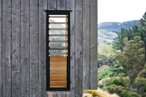 Wood wall with window treated with Wood Stain And Treatment In Silvery Patina For Exterior And Interior Use 5 Gallon Kit Covers Up To 750 Sq Ft VOC Free No Maintenance Finish Ideal For Decks Fences And Siding.