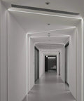 LED Neon Rope Light 50ft Flexible Strip White 6000K 120V IP67 Waterproof illuminating a modern hallway ceiling.