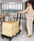 Smooth Rolling Folding Platform Trolley With Durable Steel Frame, Portable Flatbed Cart For No Sweat Household Hauling, Compact Utility Dolly For Garage Storage And Breezy Weekend Project Moving with boxes in modern interior.