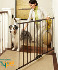 Woman using Bulletproof Hardware Mounted Walk Thru Pet Gate 31 Inches Tall Fits 28 To 48 Inch Doorways to secure a dog indoors.