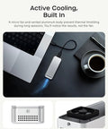 Rad Speed 80Gbps NVMe SSD Enclosure with USB4 V2 connector and active cooling on a desk near a laptop and coffee.