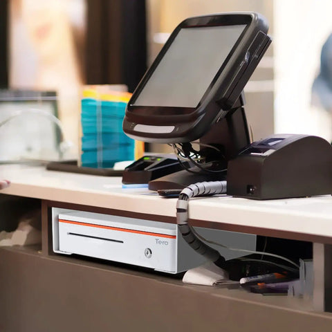 Universal Under Counter Cash Drawer Mounting Bracket Kit For 13 To 16 Inch Drawers installed under counter at retail station.