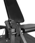 Close-up of black 2 In 1 Leg Extension And Curl Machine For Home Gym Full Leg Day Trainer showing adjustable seat and mechanism.