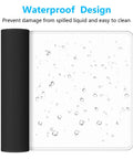 Extended Gaming Mouse Pad XL With Stitched Edges Waterproof Non Slip Desk Mat showing waterproof drops on white surface