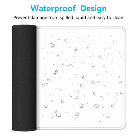 Extended Gaming Mouse Pad XL With Stitched Edges Waterproof Non Slip Desk Mat showing waterproof drops on white surface