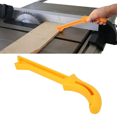 High Visibility Yellow 11 Inch Woodworking Push Stick For Table Saw And Router Tables Ergonomic Grip Safety Tool With Heavy Duty ABS Construction Jointer Friendly Precise Feed And Hands Free Control being used on a table saw