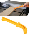 Safety Yellow Push Stick with No Slip Grip Handle for table saw and woodworking shown guiding wood for safe cutting