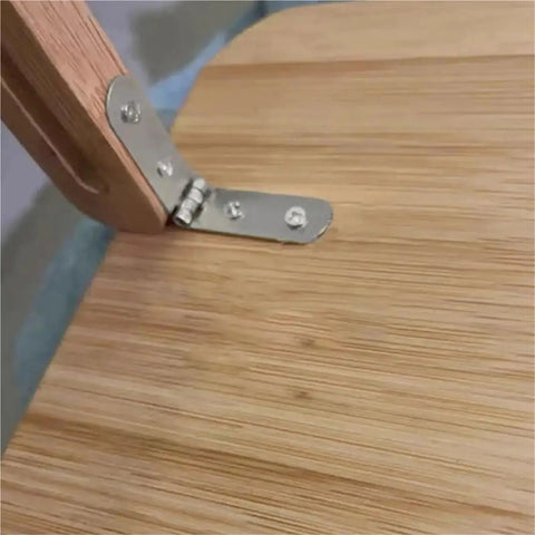 Close-up of Built Tough 180 Degree Foldable Hinge Set for Furniture and Marine Cabins, metal silver finish on wooden surface.