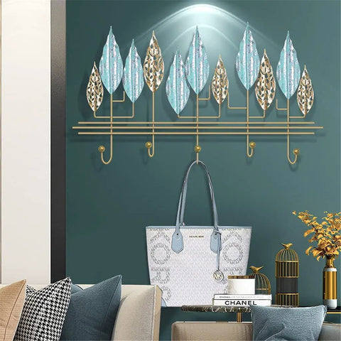 Rock-Solid Wall Mount Coat Hanger Hook Holder, Heavy-Duty Multi-Purpose Key Rack Organizer With Adjustable Hooks For Entryway, Bathroom, Bedroom And Office Storage, Tough Solution To Organize Coats Keys Umbrellas Hats Towels And Daily Gear with decorative leaf design and handbag.
